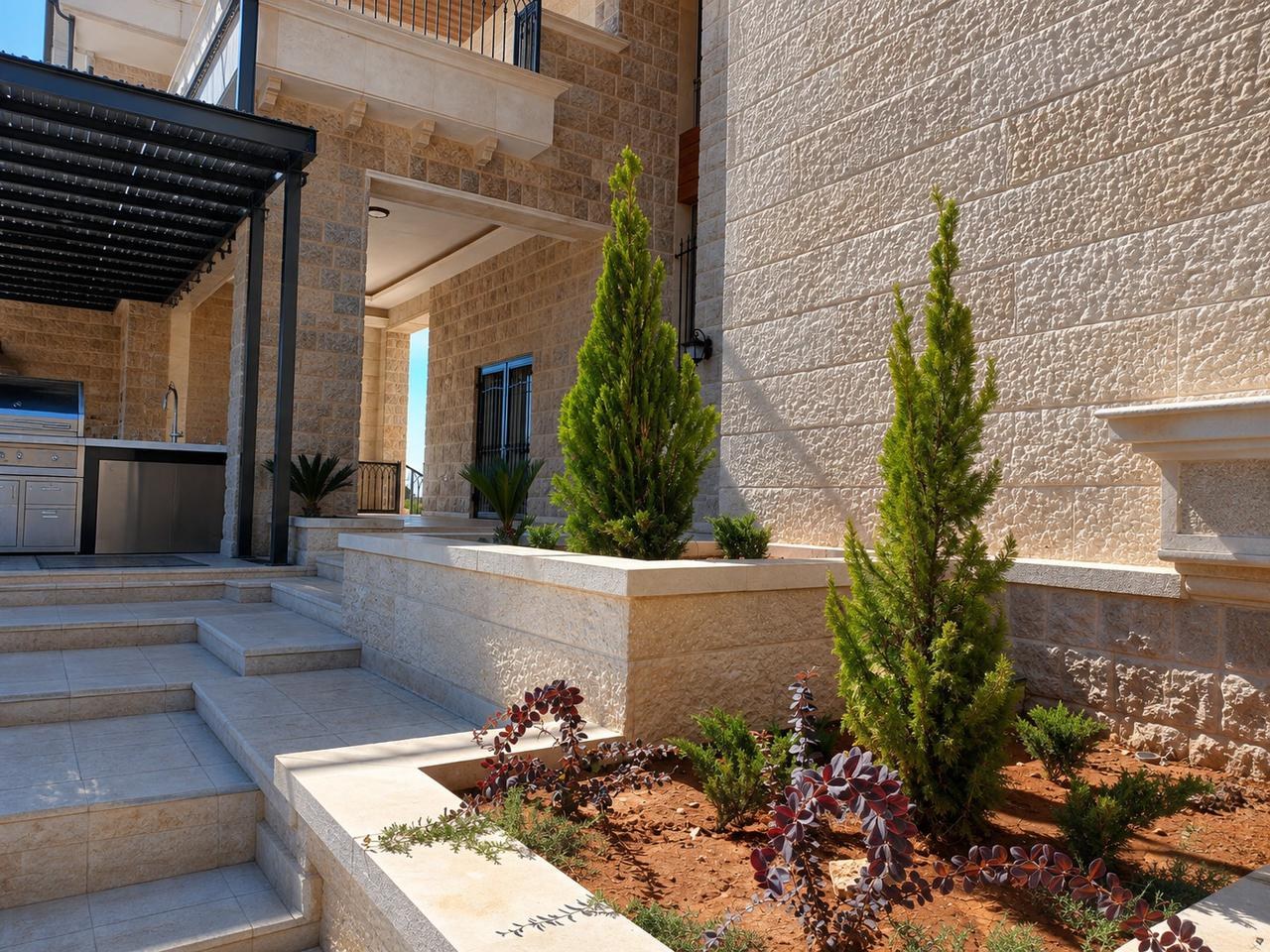 Spiral topiary in a courtyard beside a built-in barbecue, Rachaya